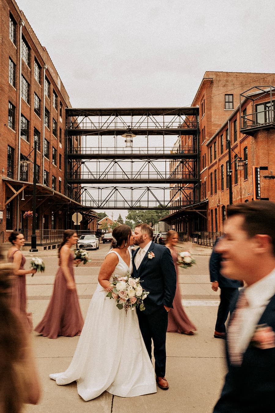 Picture of bride and groom kissing in a beautiful courtyard