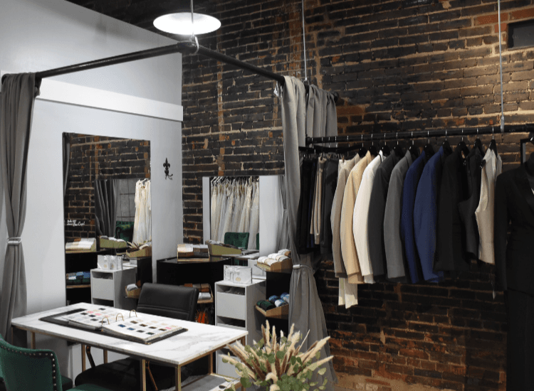 front desk with a rack of tuxedos