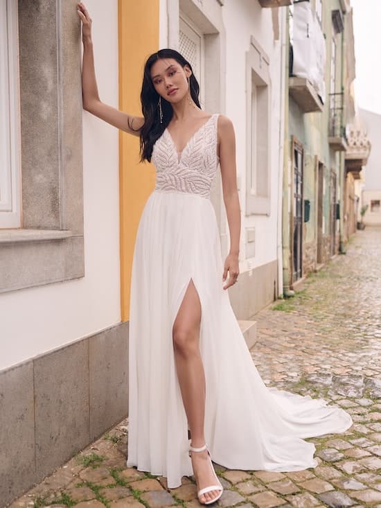 Picture of Maggie Sottero dress on bride outside of appartment building